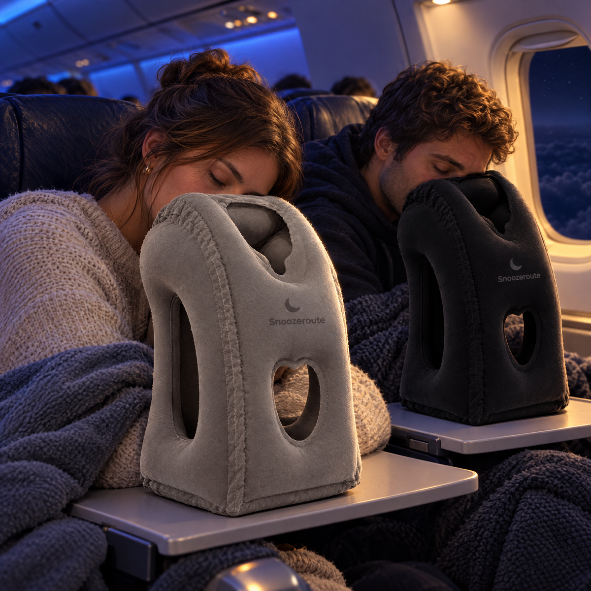 Couple sleeping on two Snooze Pillows on a night flight